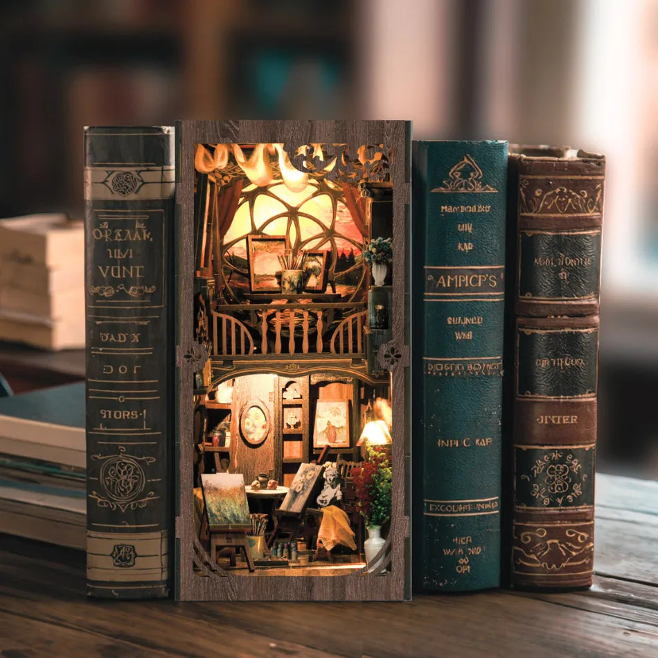 booknook with a miniature art gallery interior scene on a wooden surface.