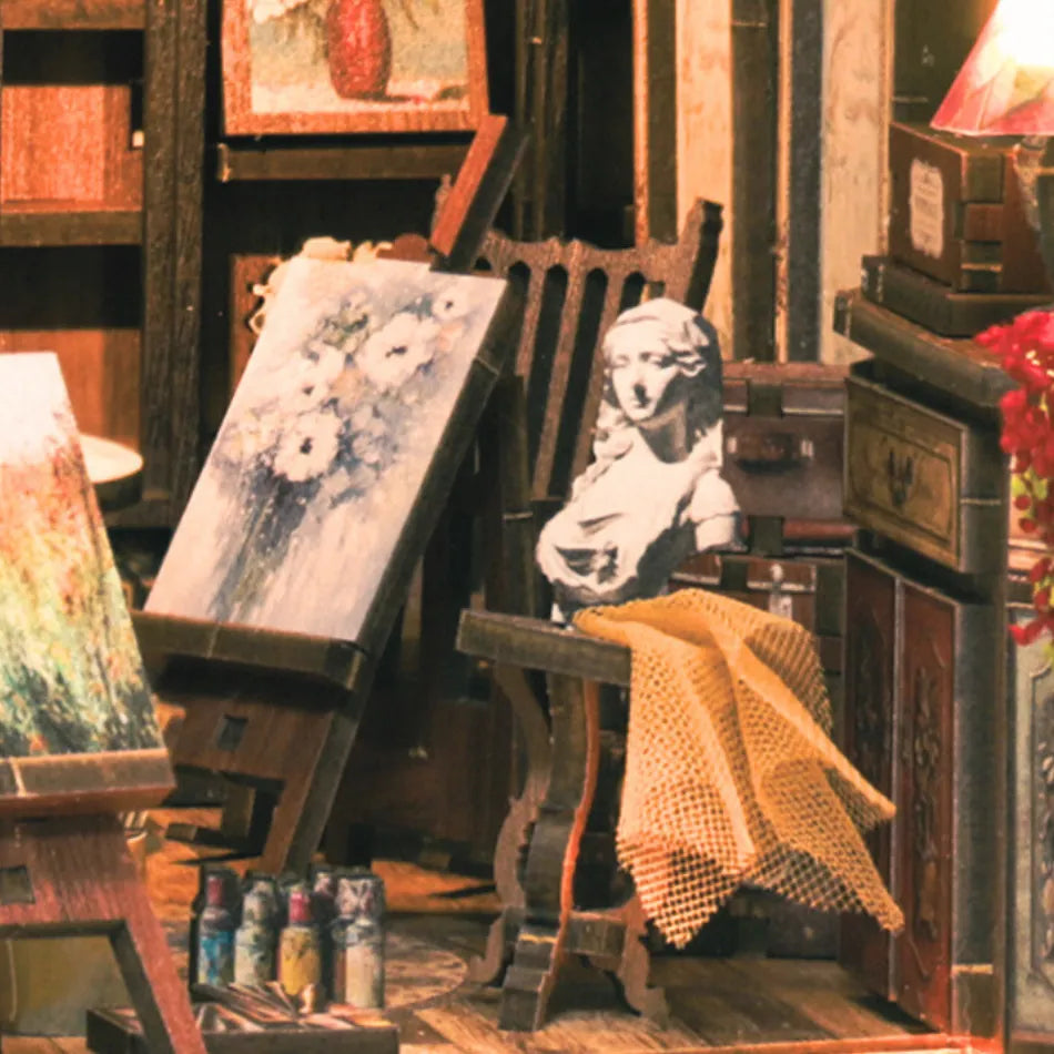 Art studio with easels, canvases, and painting supplies.