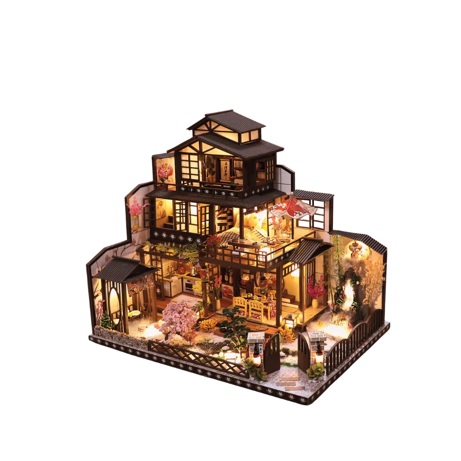 Detailed model of a house with illuminated interior on a white background