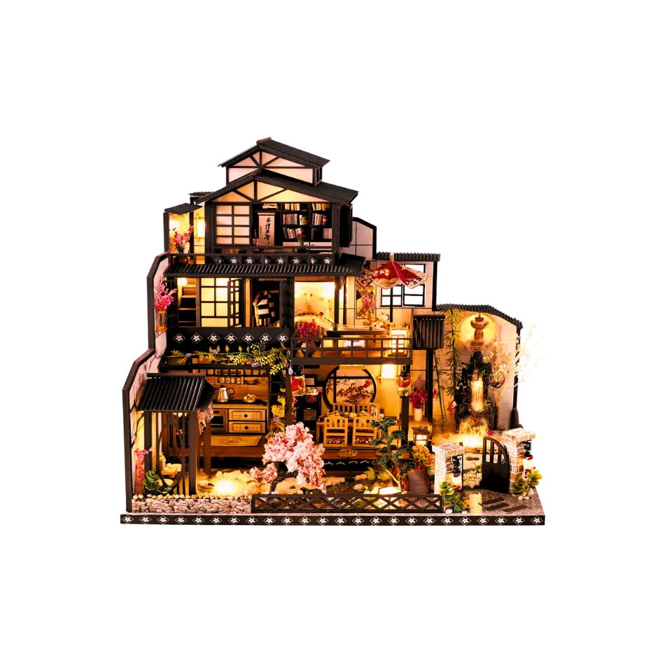 Detailed model of a house with interior lights on a white background