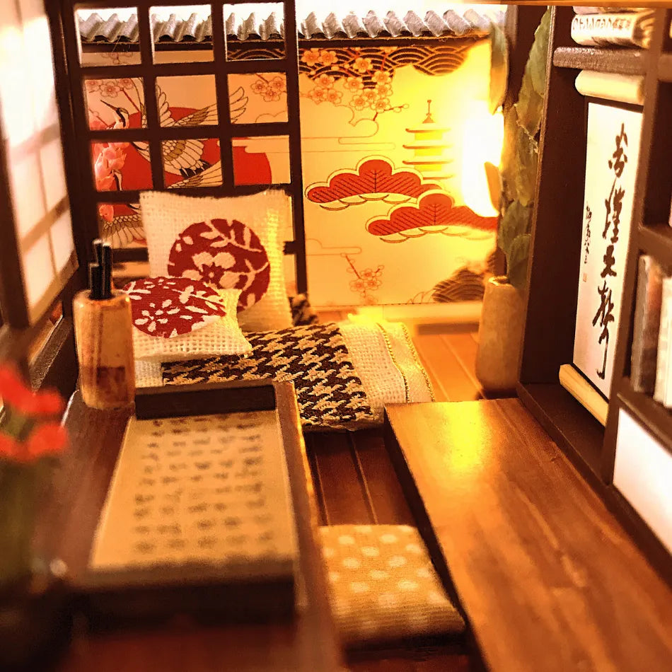 Japanese-style room with tatami mats, cushions, and decorative elements.