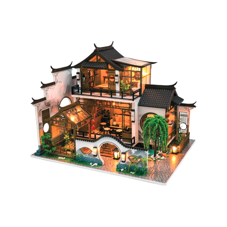 Model of a traditional Chinese house with detailed architecture on a white background