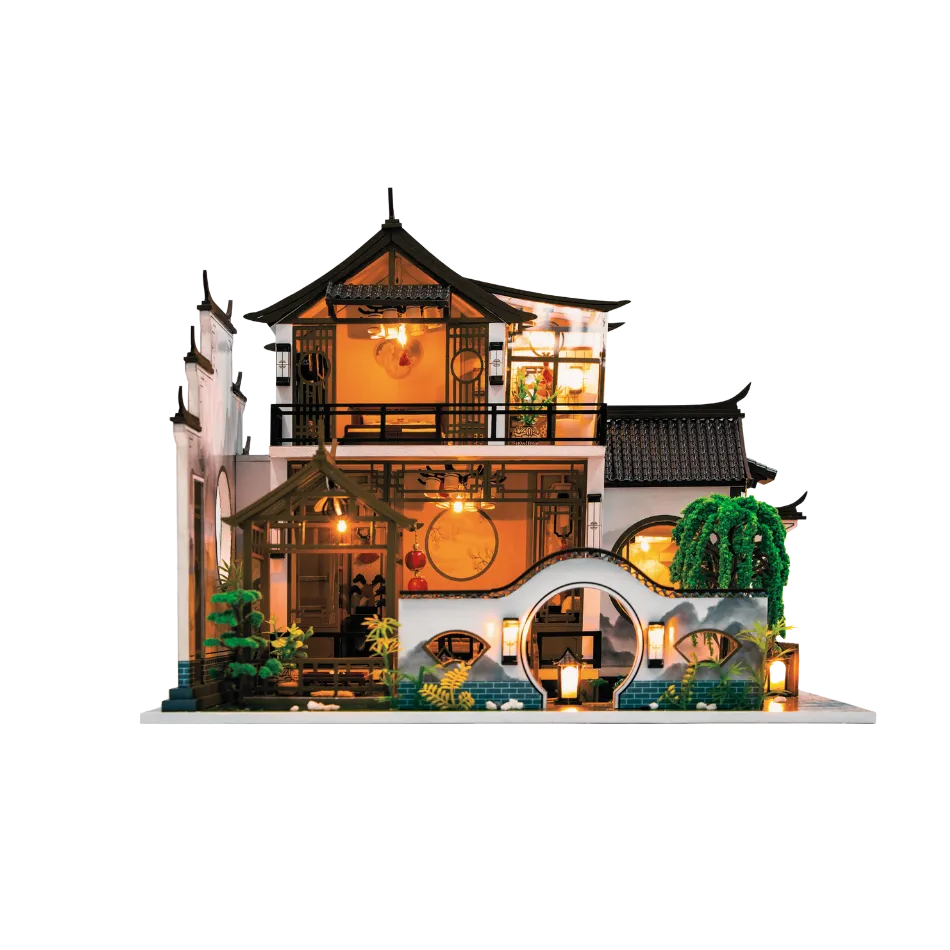 Model of a traditional Chinese house with illuminated interior on a white background