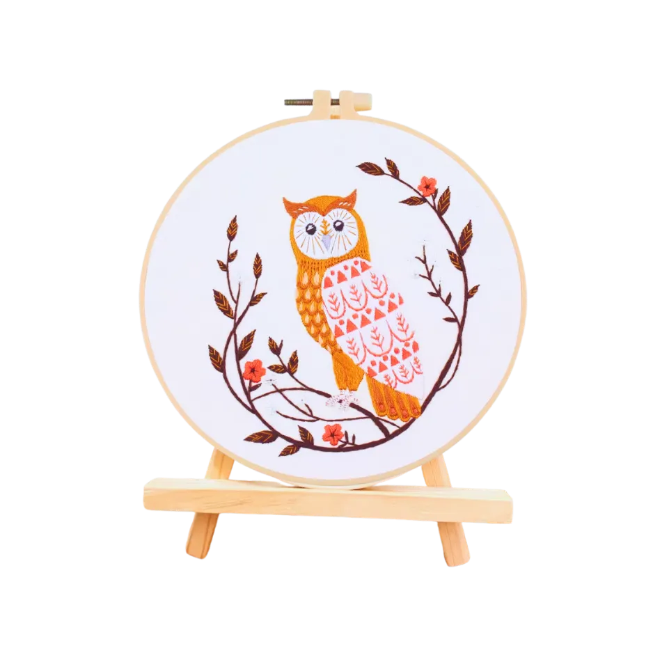 Embroidery hoop with an owl design on a white background