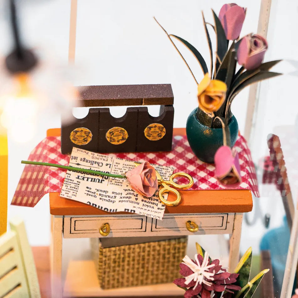 Miniature desk setup with stationery items on a checkered tablecloth