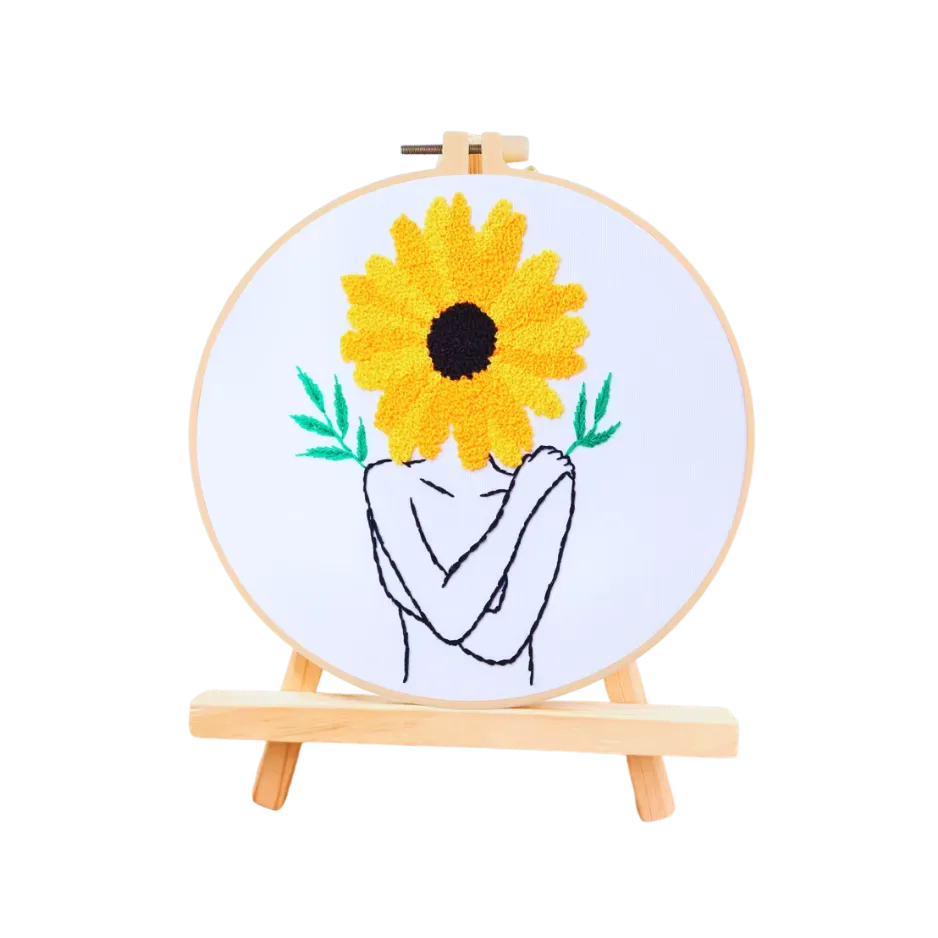Embroidery hoop with a sunflower design on a white background