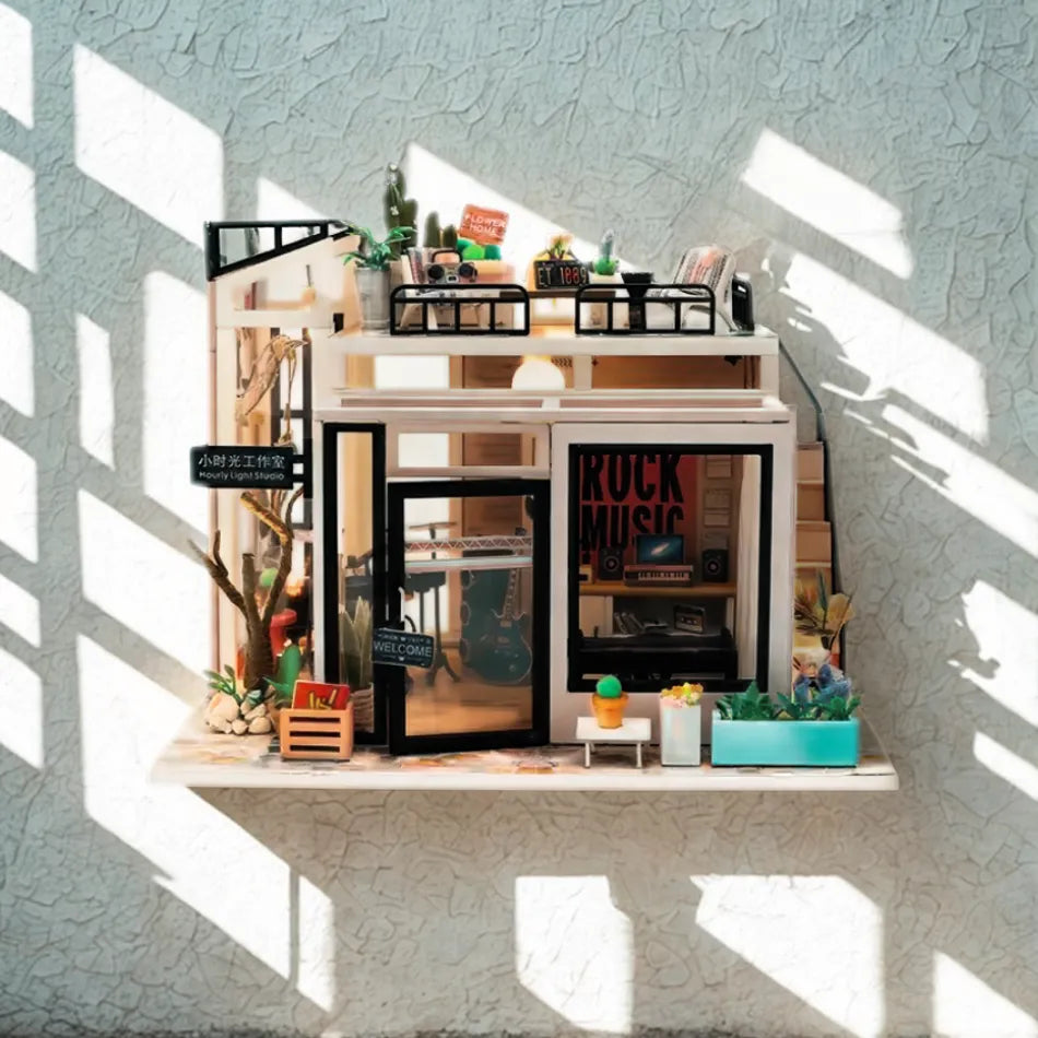 Miniature model of a rock shop with furniture and decor on a textured wall background
