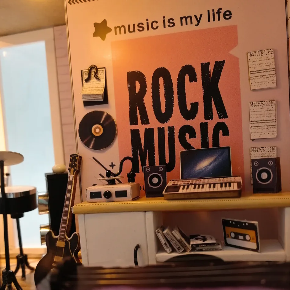 Decorative wall with 'music is my life' and 'Rock Music' sign, guitar, keyboard, and other music-themed items.