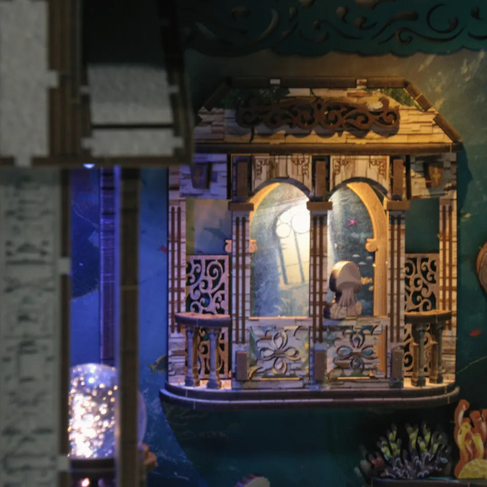 Decorative lantern with intricate designs and a blue light inside, surrounded by other decorative elements.