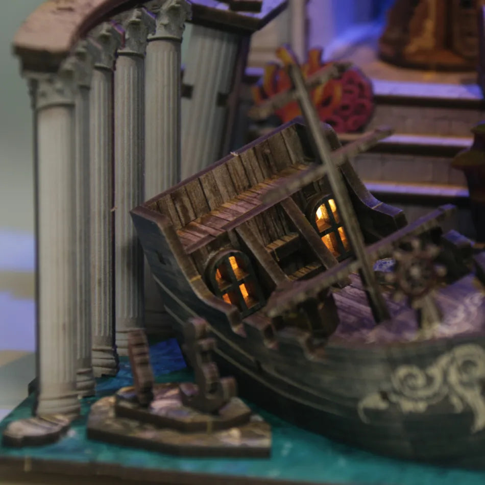 Model ship with detailed architecture and lighting effects on a blurred background
