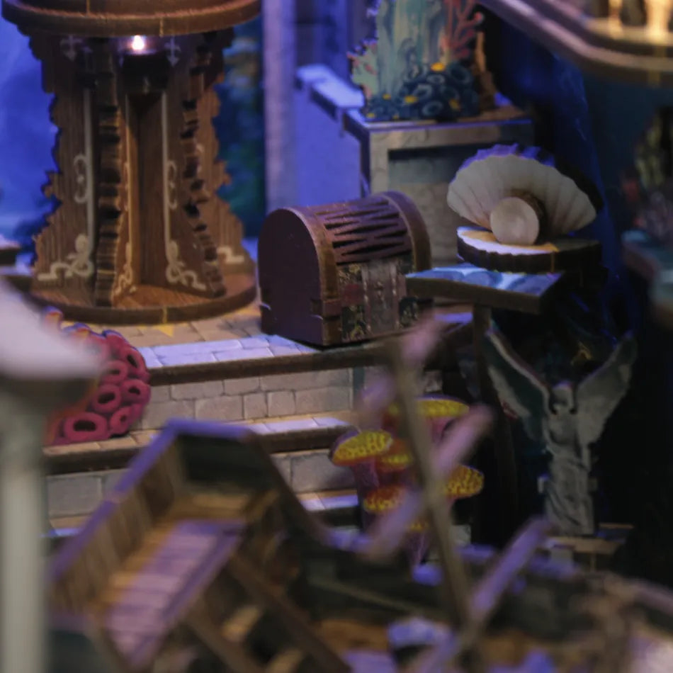 Close-up of a detailed model with architectural elements and decorative items.