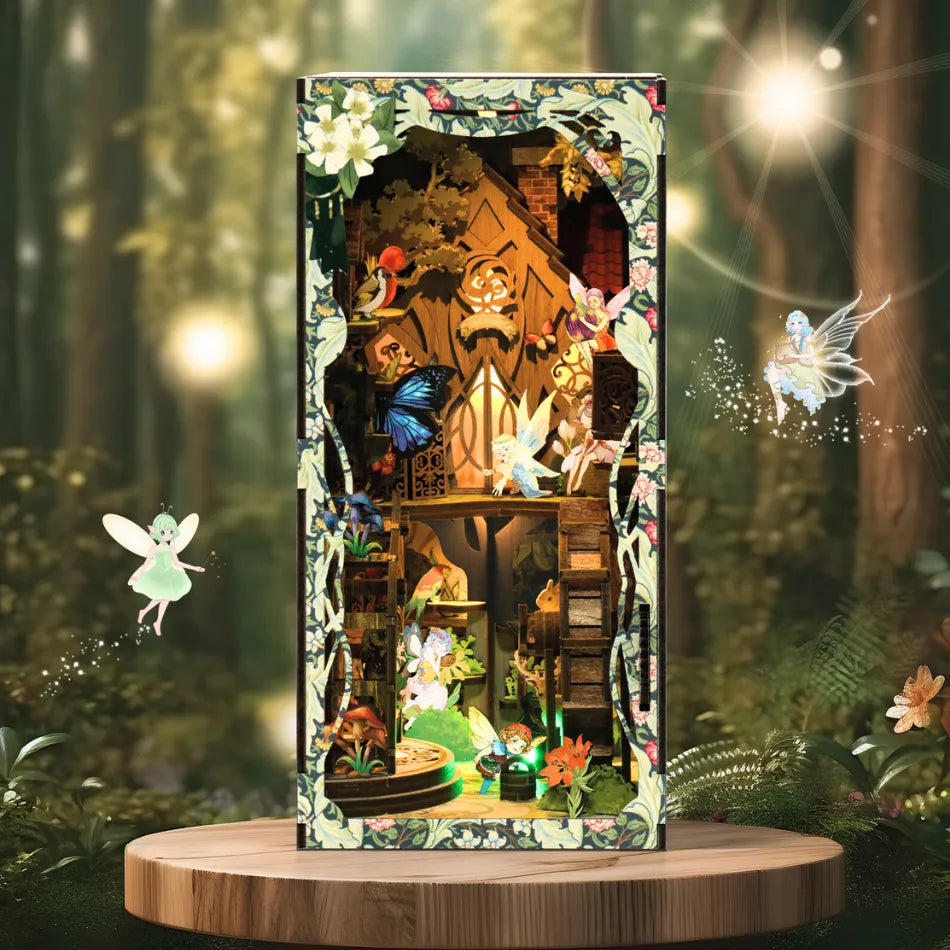 Miniature wooden fairy house diorama with glowing lights, colorful fairies, butterflies, flowers, and intricate fantasy forest details.