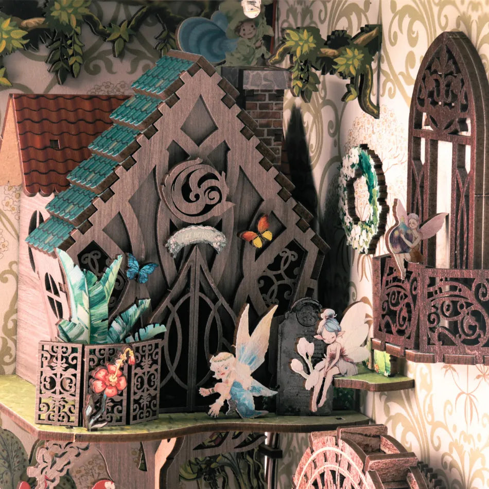 Decorative fairy garden scene with intricate wooden architecture and fairy figurines.