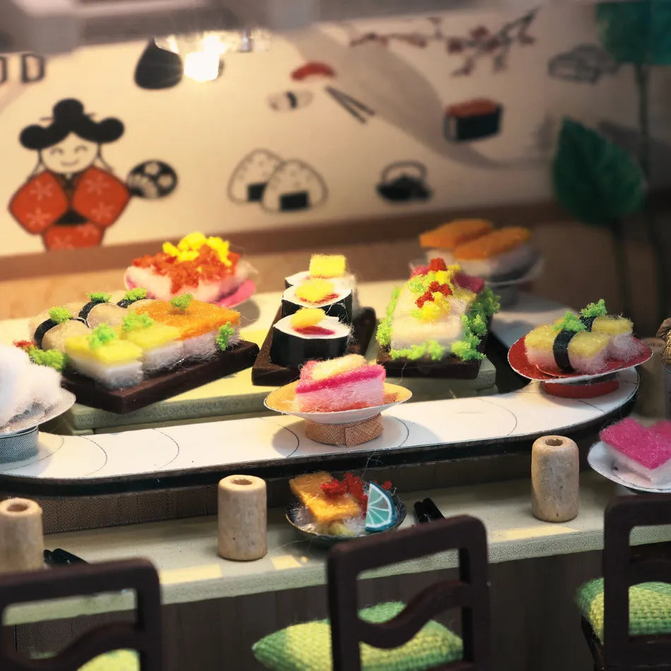 Miniature sushi set on a table with a decorative background