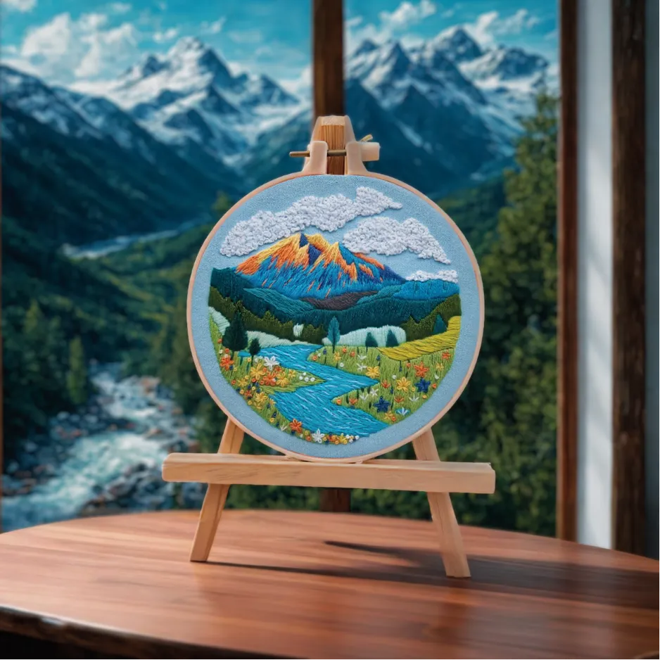Embroidery of a mountain landscape on an easel with a scenic background