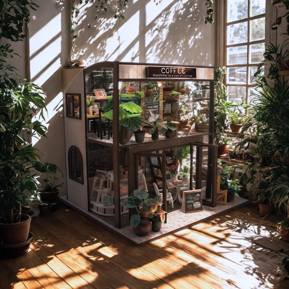 Miniature coffee shop model with plants in a sunlit room