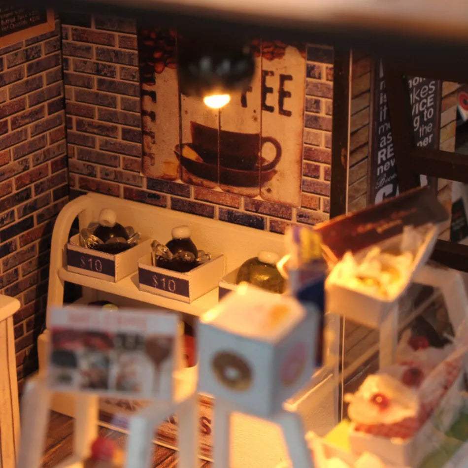 Miniature model of a coffee shop interior with props and decor.