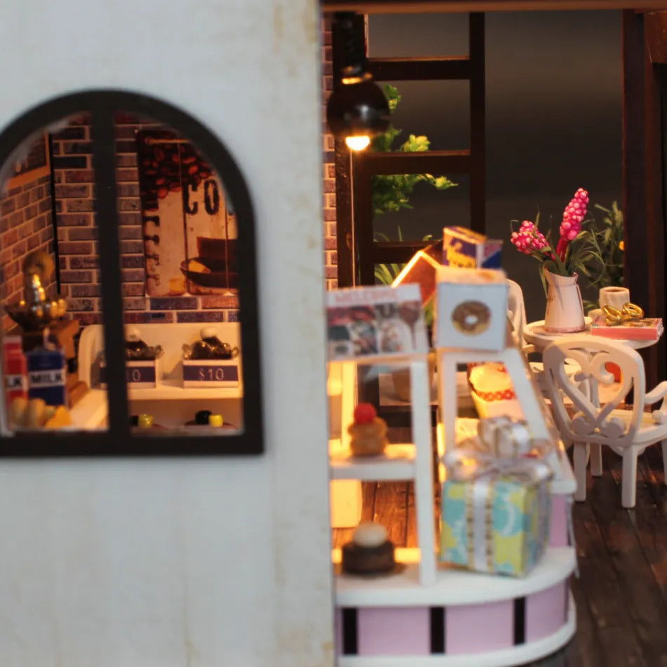 Miniature store display with shelves and mirror reflecting interior.