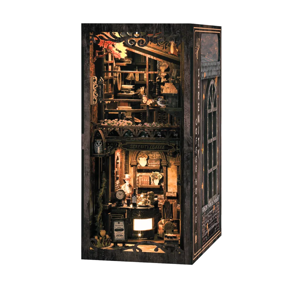 Detailed booknook with various objects inside a wooden box