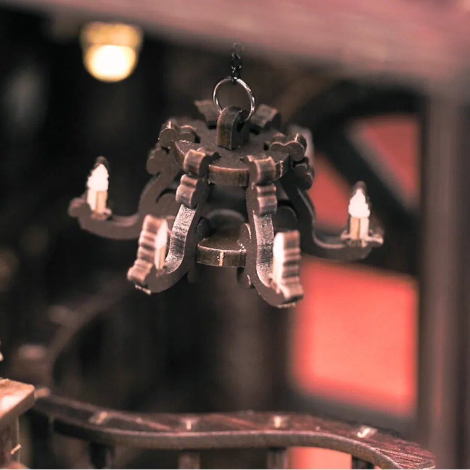 Metallic chandelier with intricate design on a blurred background