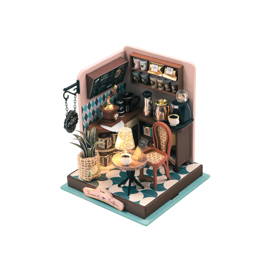 Miniature model of a coffee shop with furniture and decor on a white background