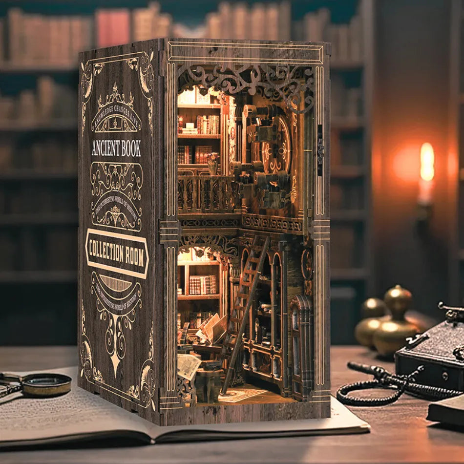 Detailed model of a book with a miniature room inside, set against a blurred bookshelf background.